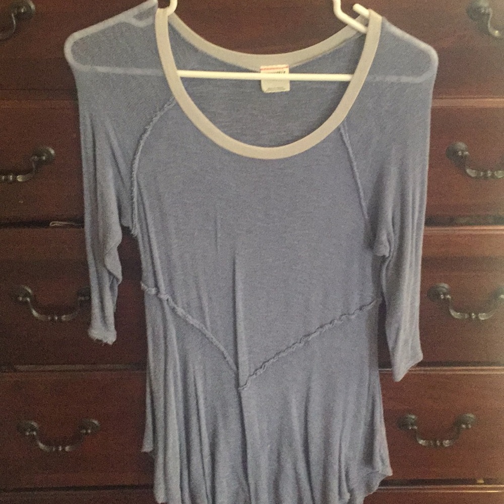 Blue tunic with grey trim at neck